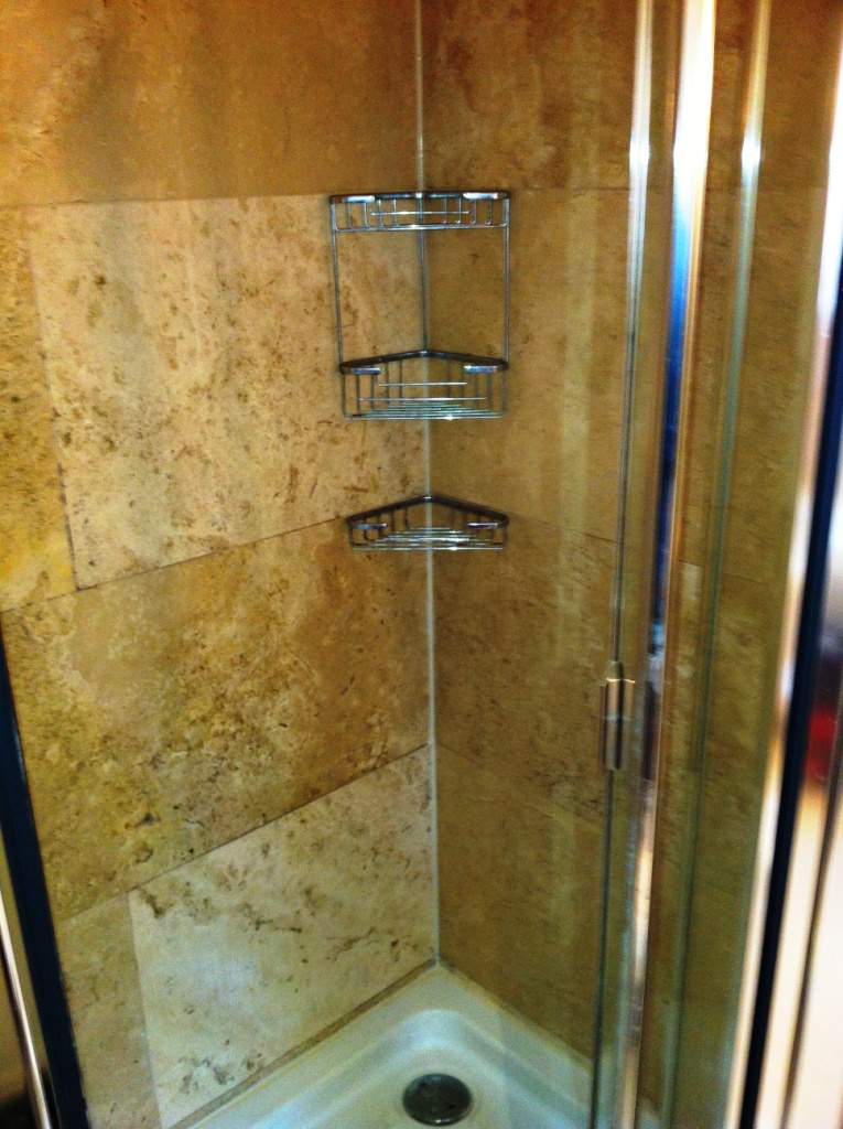 Travertine shower tile after